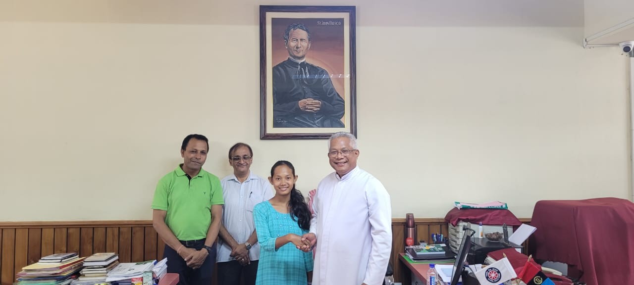 Don Bosco College Tura congratulates Ms Senganchi G Momin who secured 8th rank